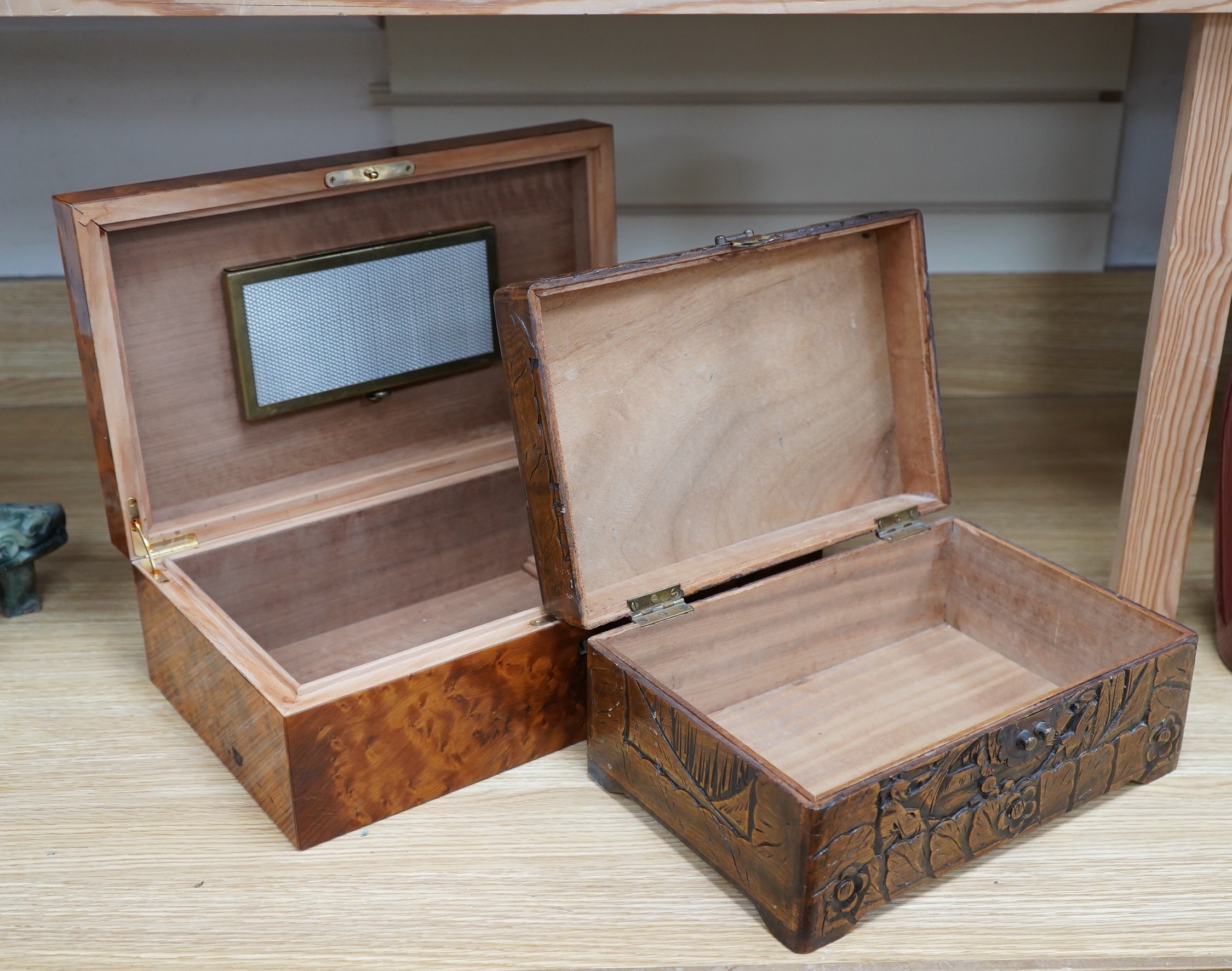 A burr walnut humidor and an Indonesian, possibly Javan, carved wood box, largest 39cm wide. Condition - fair to good